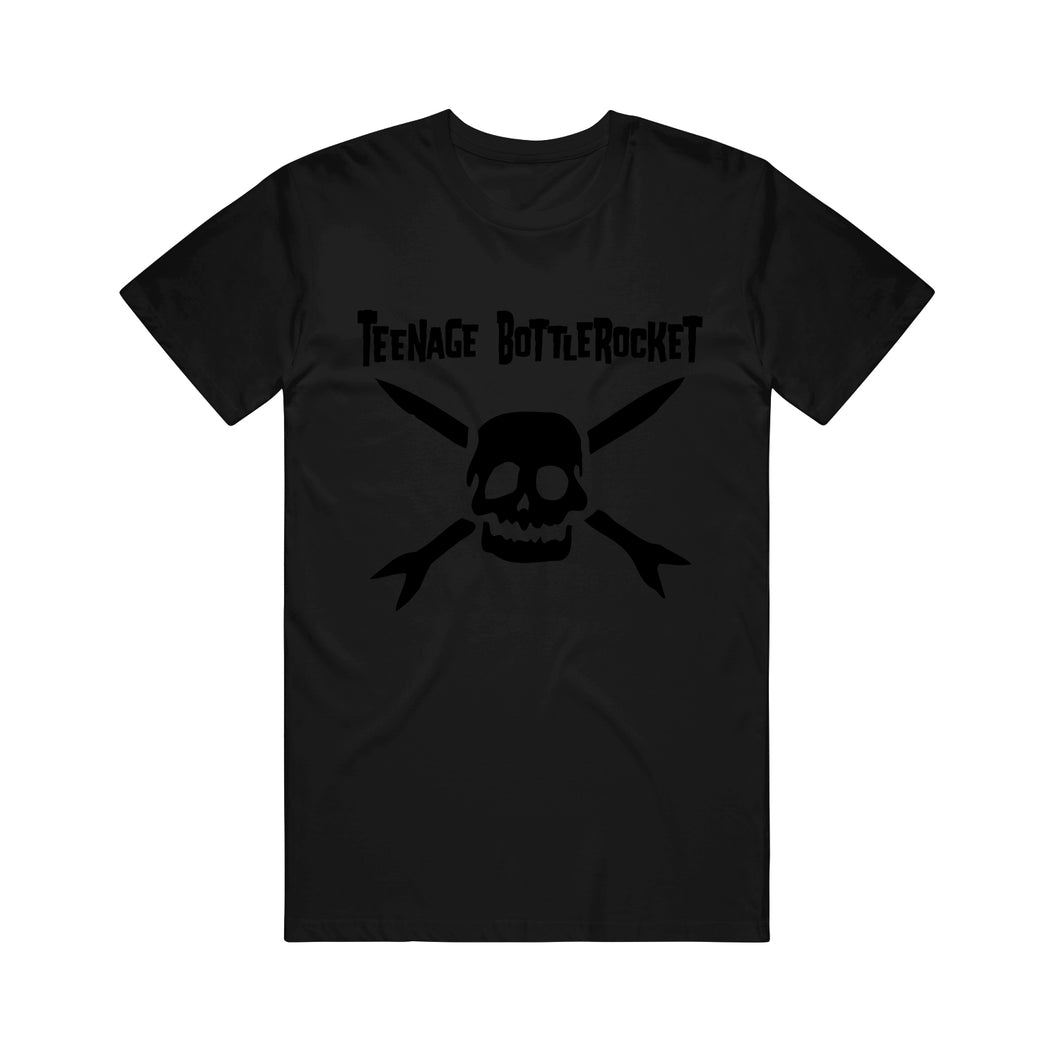 Image of a black tshirt against a white background. The center of the tshirt says teenage bottlerocket in black text across the chest. Below that is a black graphic of the teenage bottlerocket logo- a skull head with cross arrows.