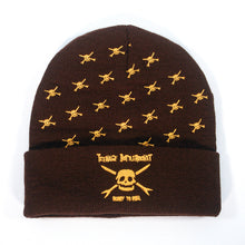 Load image into Gallery viewer, The Teenage Bottlerocket brown beanie features yellow skull and crossbones, “Teenage Bottlerocket Ready to Roll” above a large skull on the cuff—a must-have for fans.
