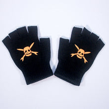 Load image into Gallery viewer, A pair of black Teenage Bottlerocket fingerless gloves featuring bold yellow skull and crossbones designs on the back, displayed flat on a white surface.
