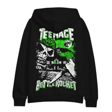 Load image into Gallery viewer,  Image of the back of a black hooded sweatshirt against a white background. The back of the sweatshirt says teenage bottlerocket in white distressed letters with a green outline. teenage is at the top, bottlerocket is at the bottom. In the middle of these words is a giant skull face looking at a haunted house. There is a full moon and a person&#39;s hand holding a knife.
